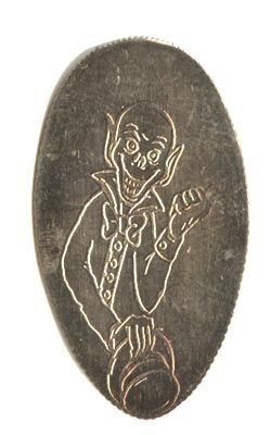 Ezra Dobbins on a pressed quarter reverse with the Haunted Mansion on the obverse
