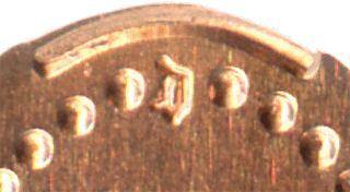 D for Disneyland near coin grip