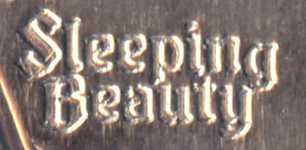 Elongated coin engraving comparison, lettering