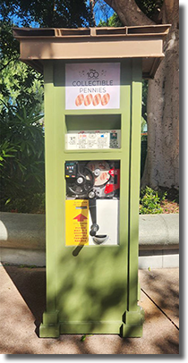 The DR0209-212 Disney100 Years of Wonder pressed penny machine near Near Tortilla Jo's Mirabel & Bruno, Nick & Judy, Ralph & Vanellope, Raya. 