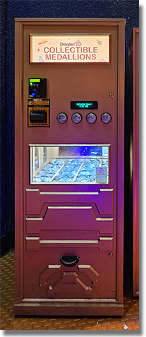 Machine: Tomorrowland 70th Anniversary Medallions Button 1: #256 70th Logo Autopia Car and Autopia Logo, Button 2: #257 70th Logo Astro Orbiter and Astro Orbiter Logo, Button 3: #258 70th Logo Stitch with Ukulele, Button 4: #259 70th Logo Mad Hatter in Tea Cup. This medallion machine was located near Star Trader / Space Mountain exit, Disneyland Park, USA. onstage by December 25, 2025.  