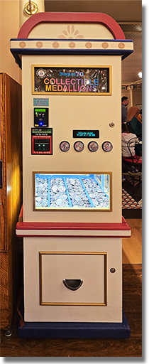 Machine Image: Candy Palace - Main Street Penny 70th Anniversary Colorized Arcade Medallions. Button 1: #252 70th Logo, Walt and Mickey, Partners with stars in the design field. Button 2: #253 70th Logo, Jiminy Cricket with stars in the design field. Button 3: #254 70th Logo, Classic Disneyland Seven Flag Roadside Marquee with stars in the design field. Button 4: #255 70th Logo, Mickey and Minnie Mouse with stars in the design field. December 25, 2025.