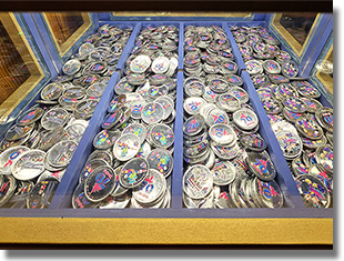 Window:  Candy Palace - Main Street Penny 70th Anniversary Colorized Arcade Medallions. Button 1: #252 70th Logo, Walt and Mickey, Partners with stars in the design field. Button 2: #253 70th Logo, Jiminy Cricket with stars in the design field. Button 3: #254 70th Logo, Classic Disneyland Seven Flag Roadside Marquee with stars in the design field. Button 4: #255 70th Logo, Mickey and Minnie Mouse with stars in the design field. December 25, 2025.