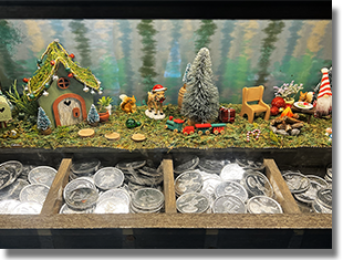 Window: Bayou Country Button 1: #256 70th Logo Haunted Mansion New Orleans Square, Button 2: #257 70th Logo Pirates of the Caribbean, Button 3: #258 70th Logo Miguel of Coco, and Button 4: #251 Mickey's Toontown which was installed in this machine by December 10, 2025. Onstage by December 25, 2025. 