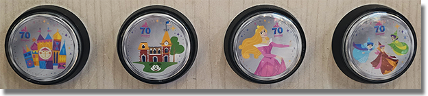 Buttons: World of Disney #1 (West) Button 1:  #279 it's a small world Colorized Disneyland Resort 70th Anniversary medallion.  Button 2: #280 Main Street Train Station Colorized Disneyland Resort 70th Anniversary medallion. Button 3: #281 Princess Aurora Colorized Disneyland Resort 70th Anniversary medallion. Button 4: #282 The Three Fairy Godmothers, Flora, Fauna and Merryweather Colorized Disneyland Resort 70th Anniversary medallion. January 8, 2026. 