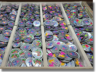 Window: World of Disney #1 (West) Button 1:  #279 it's a small world Colorized Disneyland Resort 70th Anniversary medallion.  Button 2: #280 Main Street Train Station Colorized Disneyland Resort 70th Anniversary medallion. Button 3: #281 Princess Aurora Colorized Disneyland Resort 70th Anniversary medallion. Button 4: #282 The Three Fairy Godmothers, Flora, Fauna and Merryweather Colorized Disneyland Resort 70th Anniversary medallion. January 8, 2026.