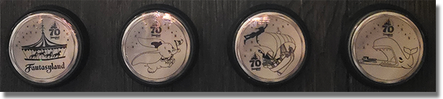 Pioneer Mercantile Buttons 1: #271 Fantasyland's King Arthur Carousel Disneyland Resort 70th Anniversary medallion. Button 2: #272 Dumbo / Jumbo Disneyland Resort 70th Anniversary medallion. Button 3: #273 Peter Pan's Flight Attraction Disneyland Resort 70th Anniversary medallion. Button 4: #274 Monstro the whale at Storybook Land Canal Boats Disneyland Resort 70th Anniversary medallion. This machine was originally located at Pioneer Mercantile in Adventureland, Disneyland Park, USA onstage by January 8, 2026.  
