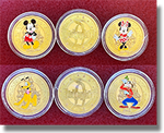 The new set of medallions at the Candy Palace / Penny Arcade on Main Street USA, Disneyland. They are Mickey, Minnie, Goofy and Pluto, guide numbers 317-320. 8-22-2026.