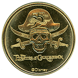 #5 reverse, Disneyland 55th Anniversary of "The Pirates of the Caribbean" #5 medallion reverse with skull and cross swords.