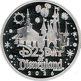 The #305 2026 Day At Disneyland medallion reverse, which has silver colored mirror-like finish with frosted devices, features Carthay Circle Restaurant, Sleeping Beauty Castle, fireworks,  and a banner that reads "D23 DAY AT DISNEYLAND&reg; RESORT  2026".  All four 2026 Day At Disneyland medallions share a similar reverse. However, each has a unique metal finish / color. August 13, 2026.