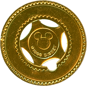 Gold Disneyland typer stamper token, 1986 variation reverse