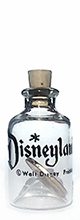 Disneyland black print Walt Disney Productions penny in a bottle.