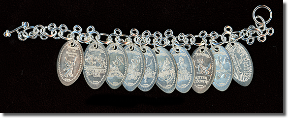 Sterling silver pressed penny bracelet, The Lands of Disneyland.